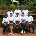 a group of chefs are posing for a picture